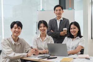 succesful business team smiling with teamwork corporate office colleague